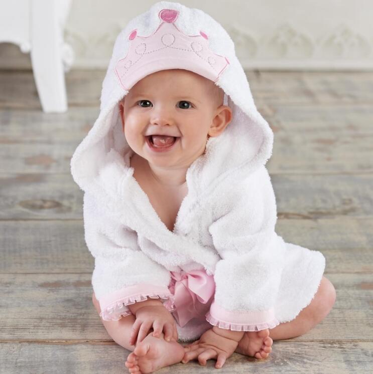 child wearing hooded cloak towel drying hair gently and safely
