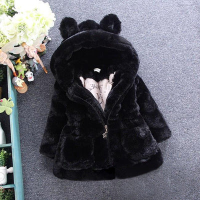girls faux fur hooded winter jacket in pink color shown on flat surface
