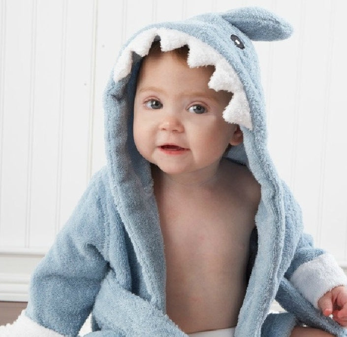 newborn wrapped in soft pure cotton bathrobe with nature-safe fabric
