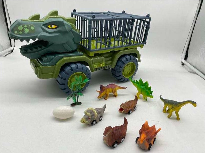 T-Rex型の恐竜輸送トラックと恐竜フィギュアが並べられたセット一式
