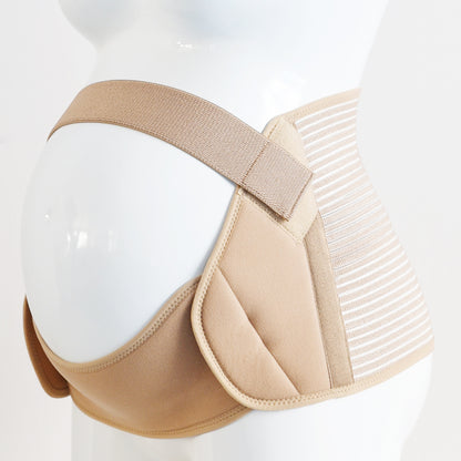 Pregnant woman gently holding belly while wearing adjustable maternity support belt
