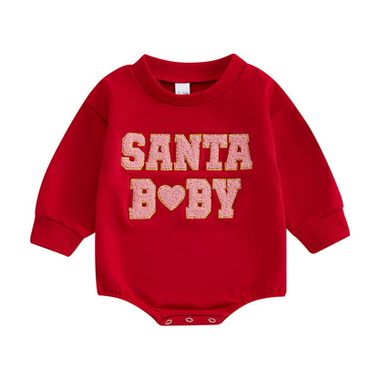festive christmas baby romper styled with gifts and holiday decorations for photoshoots
